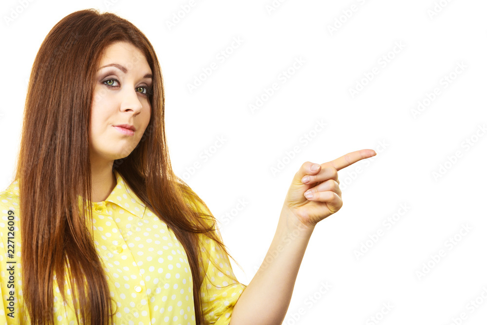 Woman pointing, serious face expression Woman pointing, serious face expression