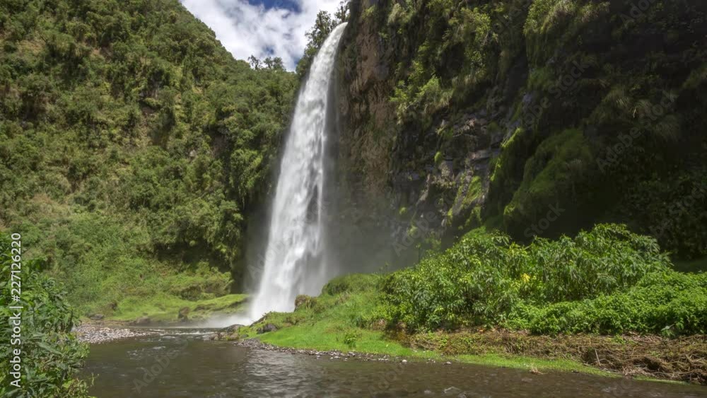 Condor Machay Waterfall in a lush cloudforest valley near Cotopaxi Volcano, Ecuador. Time-lapse. Condor Machay Waterfall in a lush cloudforest valley near Cotopaxi Volcano, Ecuador. Time-lapse.