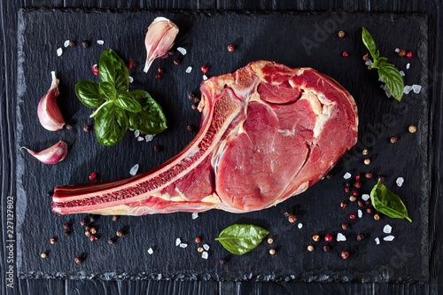 Schilderij op canvas Dry aged raw tomahawk or cowboy beef steak
