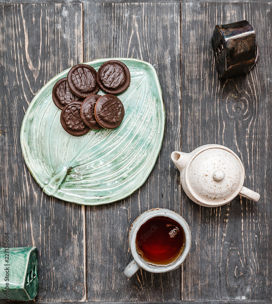 Flat top view of tea ceremony with cups of tea and sweet cookies Flat top view of tea ceremony with cups of tea and sweet cookies