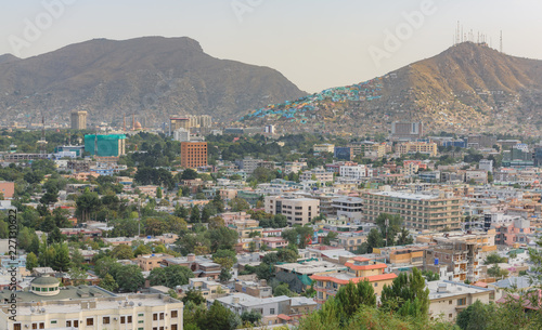 Kabul Afghanistan city scape skyline, mosque and Kabul hills mountains with houses and buildings photo