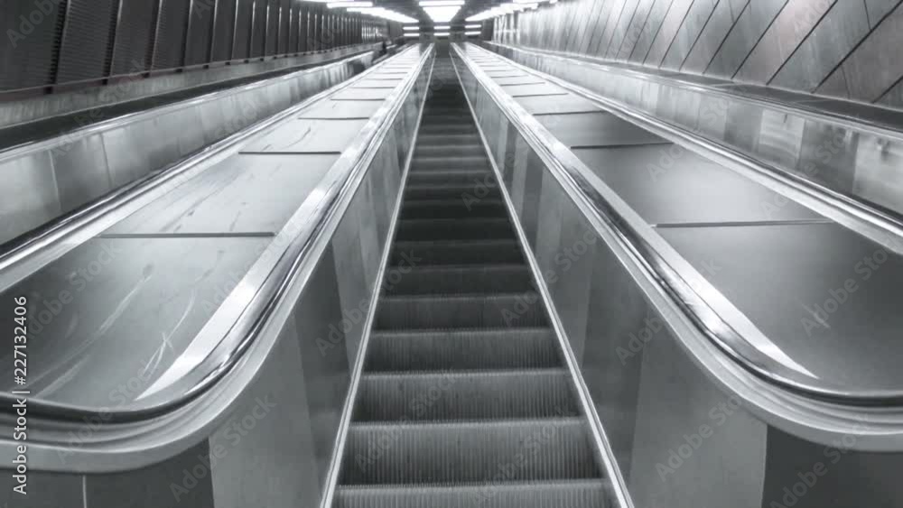 Empty escalator in dark atmosphere. Stockholm's subway, brick style wall and modern, abstract footage with stairway. Empty escalator in dark atmosphere. Stockholm's subway, brick style wall and modern, abstract footage with stairway.