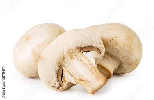 Fresh champignons and half close-up on a white. Isolated.