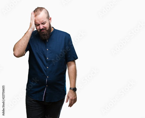 Young caucasian hipster man over isolated background suffering from headache desperate and stressed because pain and migraine. Hands on head.