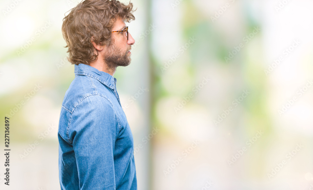 Handsome hispanic model man wearing glasses over isolated background looking to side, relax profile pose with natural face with confident smile. Handsome hispanic model man wearing glasses over isolated background looking to side, relax profile pose with natural face with confident smile.