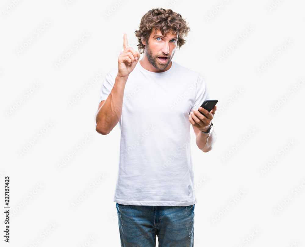 Handsome hispanic man model sending message texting using smartphone over isolated background surprised with an idea or question pointing finger with happy face, number one Handsome hispanic man model sending message texting using smartphone over isolated background surprised with an idea or question pointing finger with happy face, number one