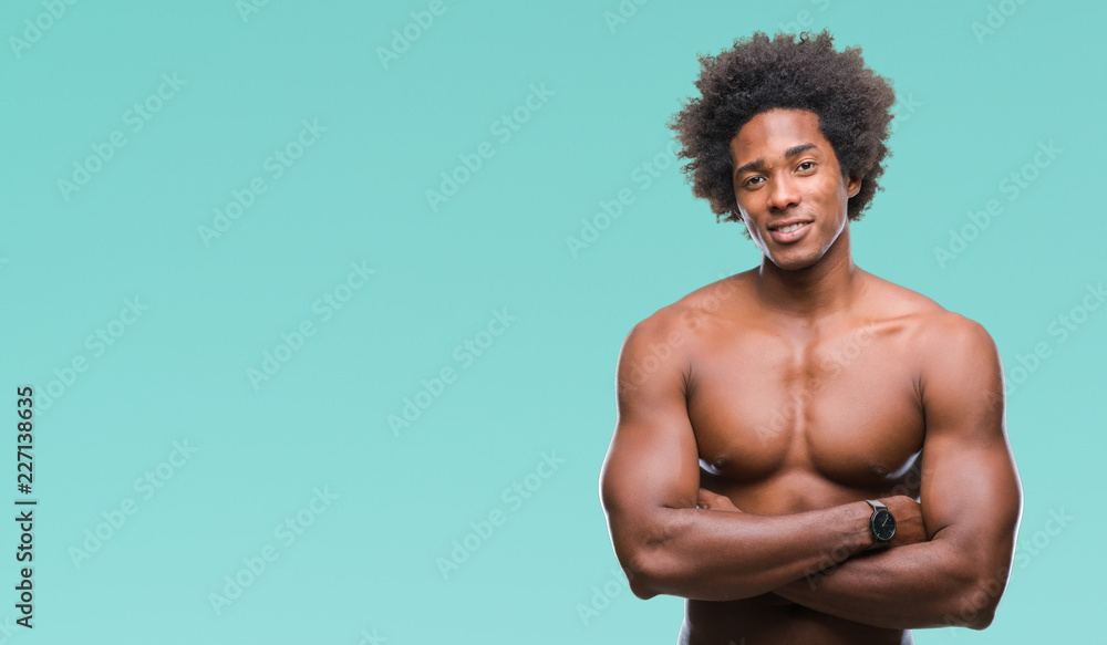 Afro american shirtless man showing nude body over isolated background happy face smiling with crossed arms looking at the camera. Positive person. Afro american shirtless man showing nude body over isolated background happy face smiling with crossed arms looking at the camera. Positive person.