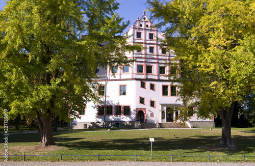 Ponitz / Germany: Renovated Renaissance manor house with Neo-Gothic portal on a sunny day in October photo