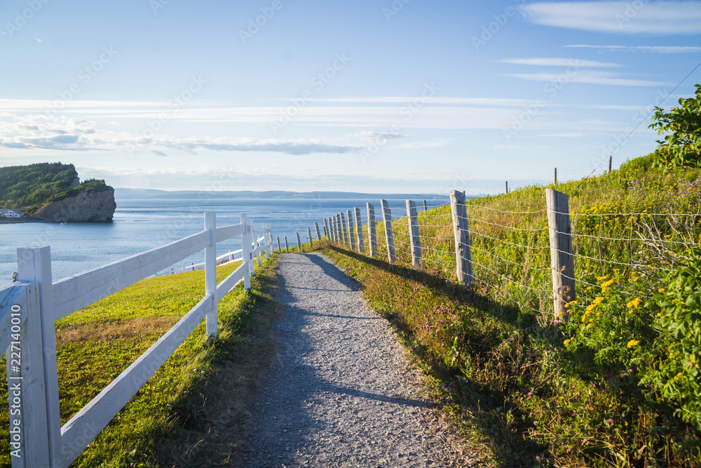 View of Gulf of Saint Lawrence from Perce village trail at summer sunset View of Gulf of Saint Lawrence from Perce village trail at summer sunset