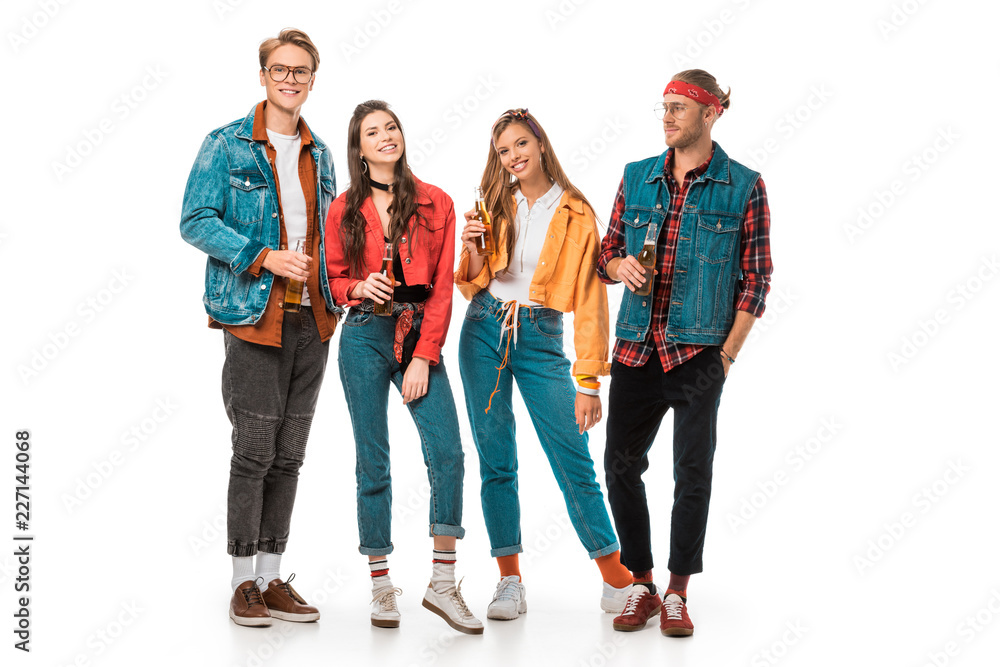 Fototapeta premium smiling young hipster friends having fun with beer bottles isolated on white