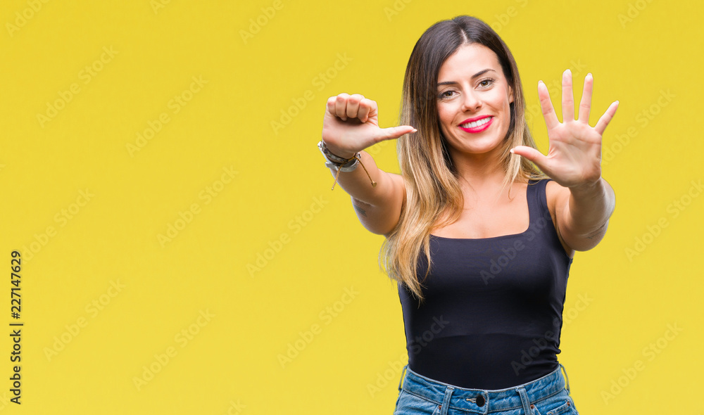 Naklejka premium Young beautiful woman over isolated background showing and pointing up with fingers number six while smiling confident and happy.