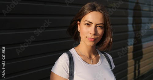 Portrait of stylish serious girl with glasses posing in city.  © VAKSMANV