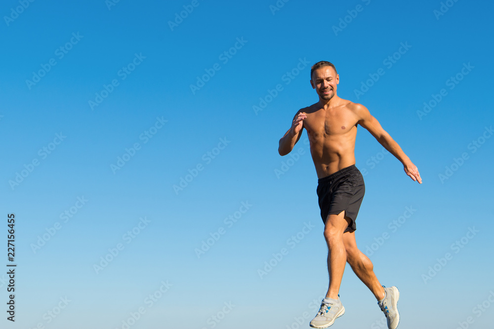 Morning run fills with energy. Motivation and achievement. Run morning habit. Runner motion forward sky background. Forward to success. Daily training for healthy life. Man athlete muscular torso run Morning run fills with energy. Motivation and achievement. Run morning habit. Runner motion forward sky background. Forward to success. Daily training for healthy life. Man athlete muscular torso run