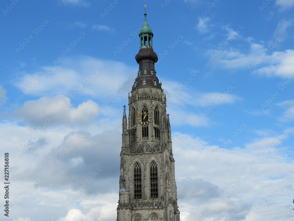 Grote Kerk gothic church tower in Breda Netherlands, blue sky