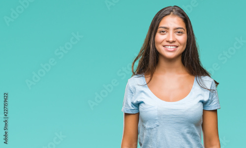 Young beautiful arab woman over isolated background with a happy and cool smile on face. Lucky person. © Krakenimages.com