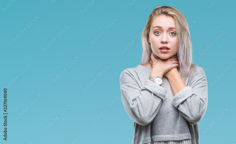 Young blonde woman over isolated background shouting and suffocate because painful strangle. Health problem. Asphyxiate and suicide concept. Young blonde woman over isolated background shouting and suffocate because painful strangle. Health problem. Asphyxiate and suicide concept.