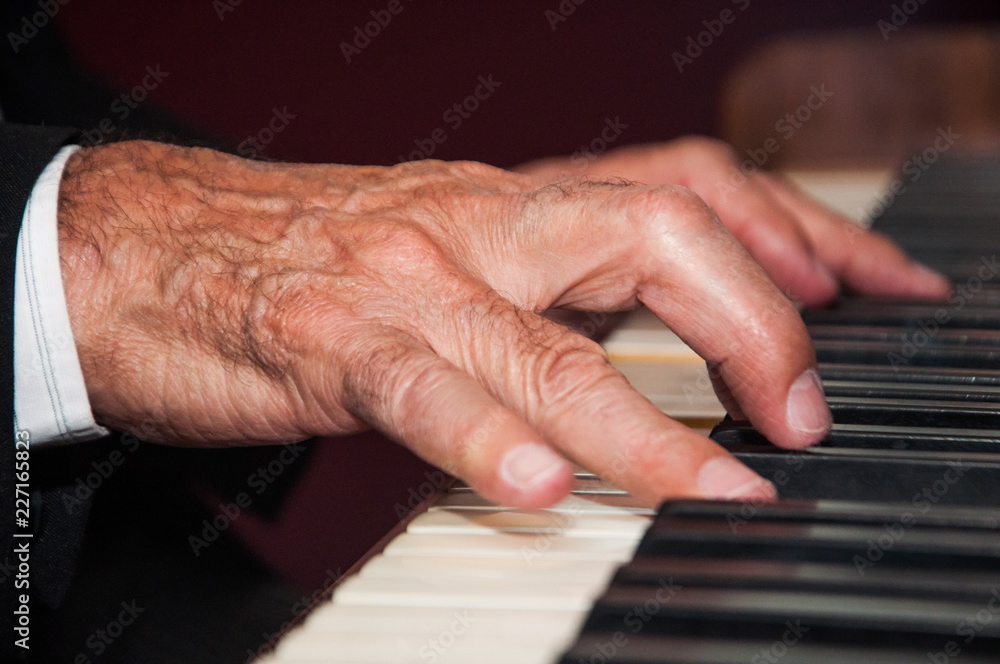 hands on piano keyboard