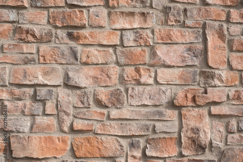 Obraz premium CLOSE UP ORAGNE STONE WALL