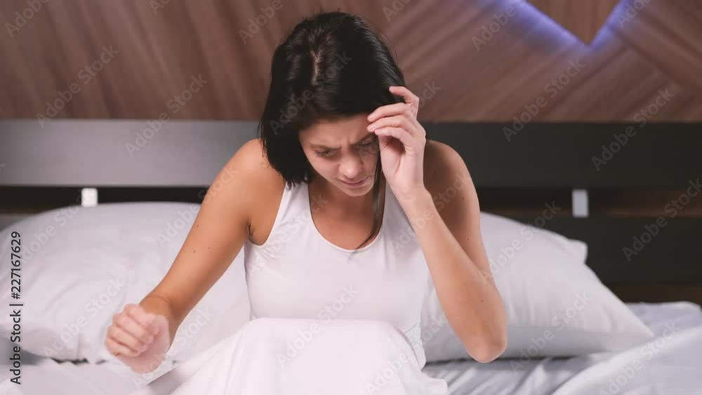 Attractive young girl at home. Waking up in bad mood Attractive young girl at home. Waking up in bad mood