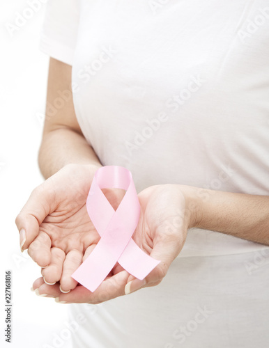Woman holding a pink ribbon.