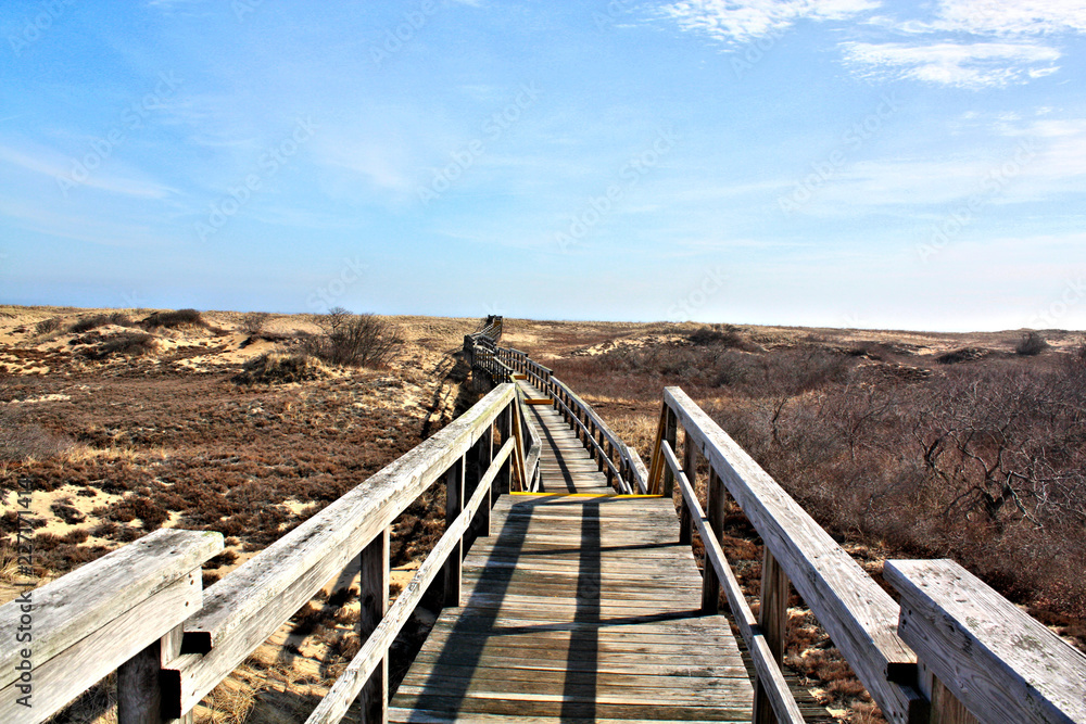 Safe walk over the Sand Dunes. This wooden walk way to the Atlantic Ocean was constructed to protect the sand dunes t plum Island Massachusetts USA Safe walk over the Sand Dunes. This wooden walk way to the Atlantic Ocean was constructed to protect the sand dunes t plum Island Massachusetts USA