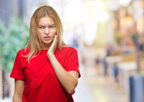 Young caucasian woman over isolated background touching mouth with hand with painful expression because of toothache or dental illness on teeth. Dentist concept.