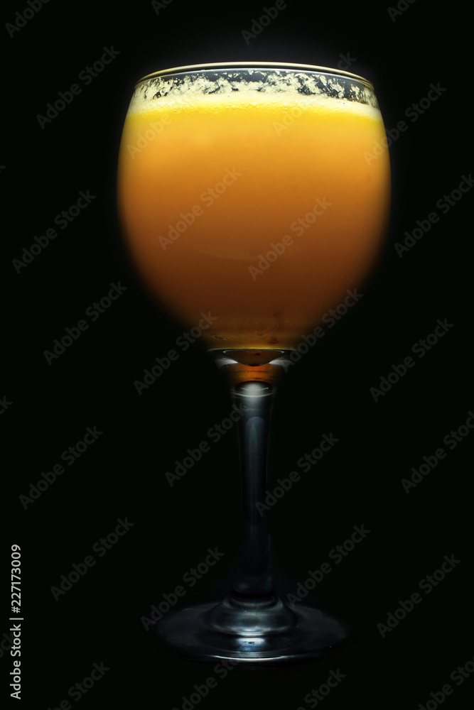 glass of wine whith juice on black background glass of wine whith juice on black background
