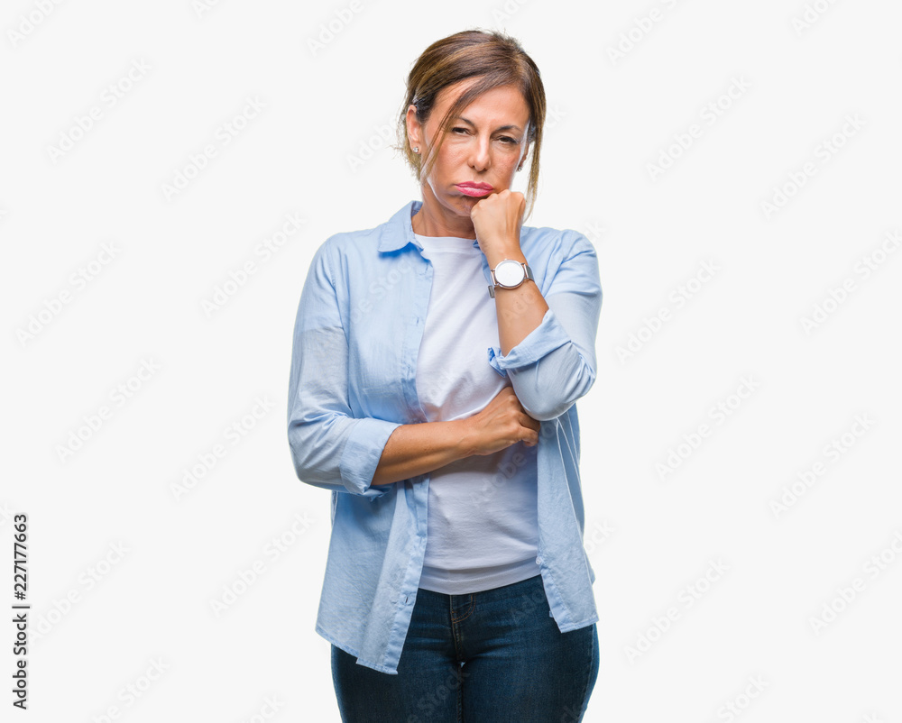 Middle age senior hispanic woman over isolated background thinking looking tired and bored with depression problems with crossed arms. Middle age senior hispanic woman over isolated background thinking looking tired and bored with depression problems with crossed arms.