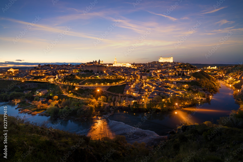 Panoramic view of the medieval center of the city of Toledo, Spain. It features the Tejo river, the Cathedral and Alcazar of Toledo, Spain..