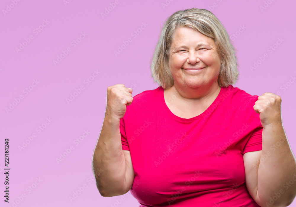 Senior plus size caucasian woman over isolated background very happy and excited doing winner gesture with arms raised, smiling and screaming for success. Celebration concept. Senior plus size caucasian woman over isolated background very happy and excited doing winner gesture with arms raised, smiling and screaming for success. Celebration concept.