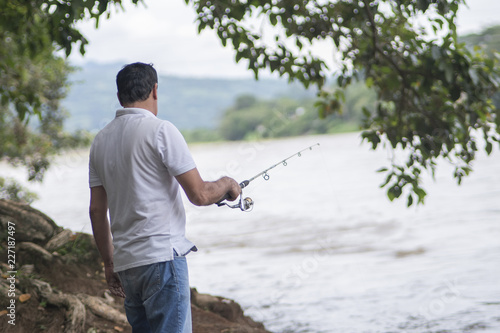 adult man fishing in the river