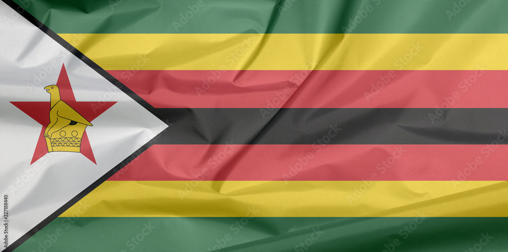 Fabric flag of Zimbabwe. Crease of Zimbabwean flag background, seven  horizontal stripes of green yellow red black with a black-edged white with  a bird on a red star. Stock Photo | Adobe
