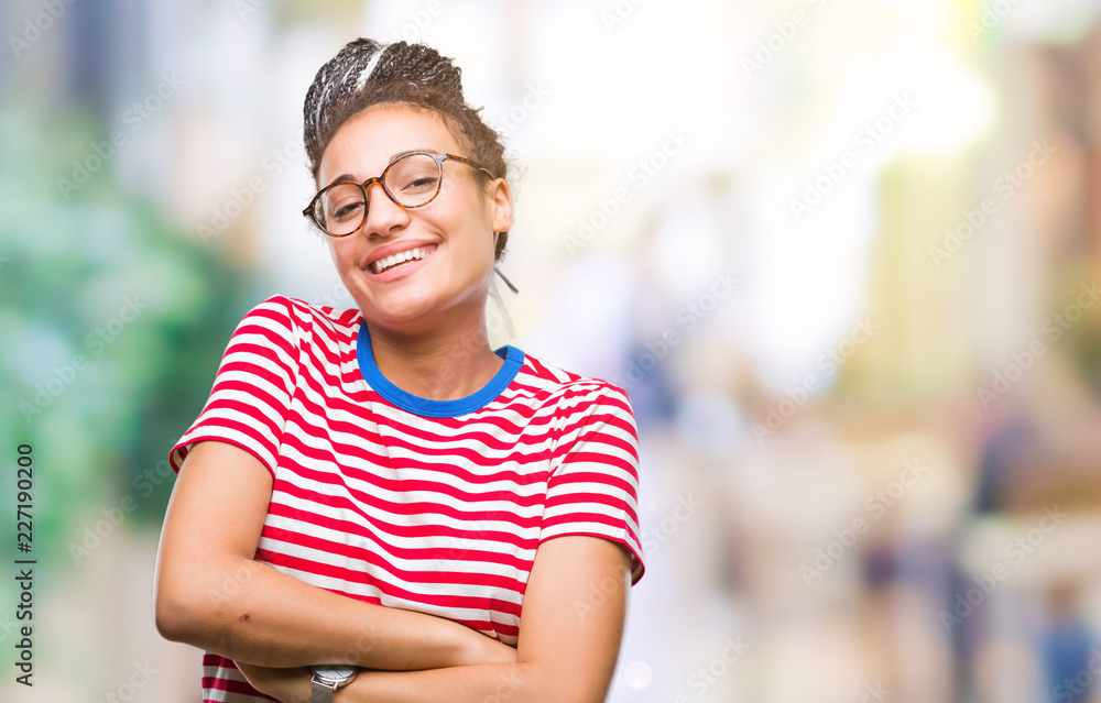 Young braided hair african american girl wearing glasses over isolated background happy face smiling with crossed arms looking at the camera. Positive person. Young braided hair african american girl wearing glasses over isolated background happy face smiling with crossed arms looking at the camera. Positive person.