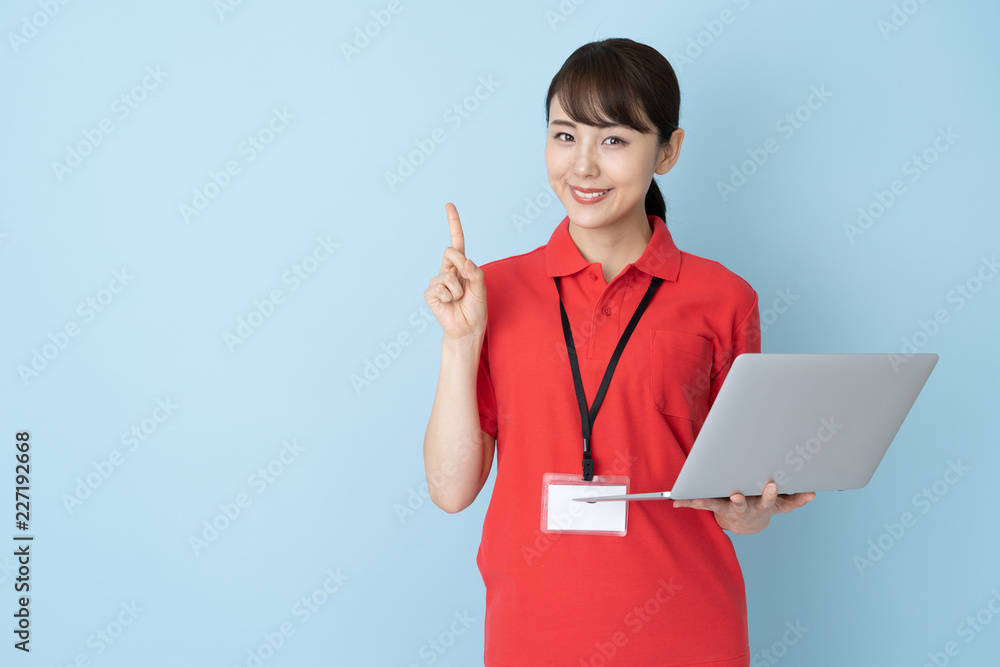 portrait of young asian woman wearing red polo shirts on blue background portrait of young asian woman wearing red polo shirts on blue background