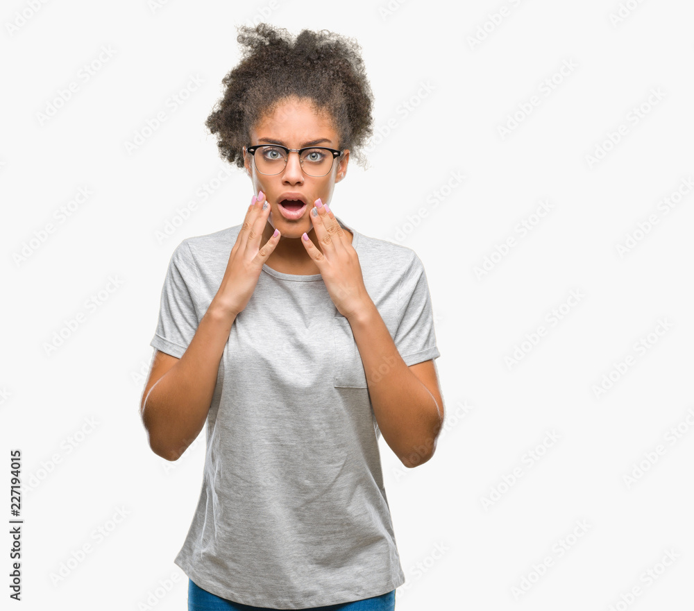 Young afro american woman wearing glasses over isolated background afraid and shocked with surprise expression, fear and excited face. Young afro american woman wearing glasses over isolated background afraid and shocked with surprise expression, fear and excited face.