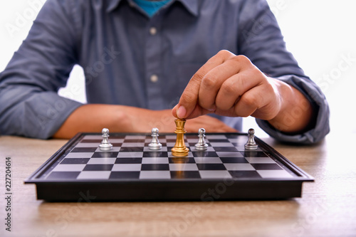 Leadership Concepts. Chess is a leader. Comparing chess is a strategic business plan. Chess game on a black background.
