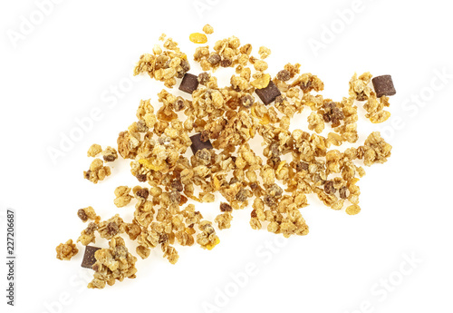 Crunchy granola, muesli pile with chocolate isolated on white background. Top view.