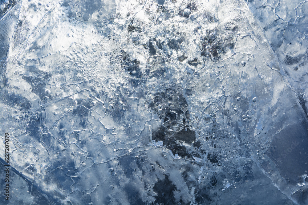 The texture of the ice. The frozen water.Winter background The texture of the ice. The frozen water.Winter background