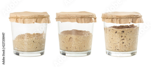Process of fermentation of homemade rye bread sourdough isolated on white background. photo