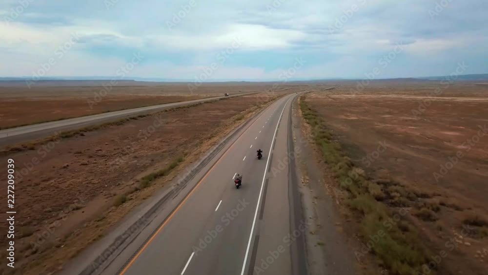 Drone view of road with motorcicles traffic near Moab - Utah - USA Drone view of road with motorcicles traffic near Moab - Utah - USA