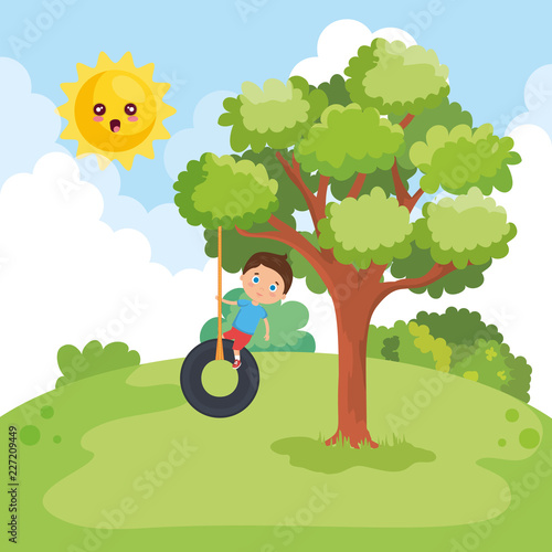 cute little boy playing in swing