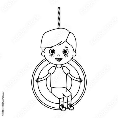 cute little boy playing in swing