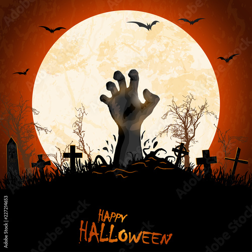 halloween zombie hand in front of full moon