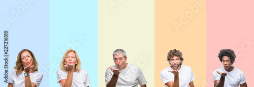 Collage of group of young and middle age people wearing white t-shirt over color isolated background looking at the camera blowing a kiss with hand on air being lovely and sexy. Love expression.