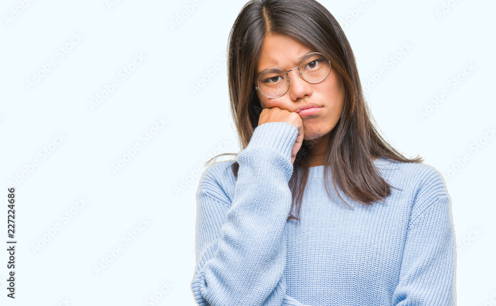 Young asian woman wearing winter sweater over isolated background thinking looking tired and bored with depression problems with crossed arms. Young asian woman wearing winter sweater over isolated background thinking looking tired and bored with depression problems with crossed arms.