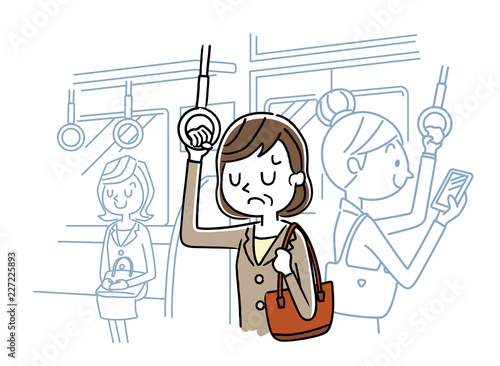 電車で通勤：落ち込む中年女性 