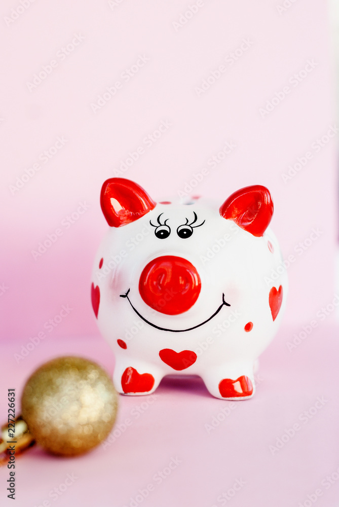 Piggy bank over pink background with christmas decoration copy space. Year of pig 2019. Piggy bank over pink background with christmas decoration copy space. Year of pig 2019.