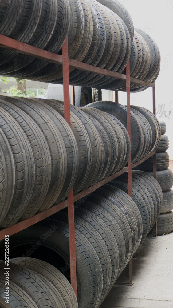 car tires in a row for sale at booth in store car tires in a row for sale at booth in store