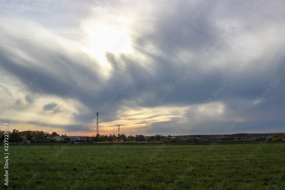 landscape with road, clouds and buildings landscape with road, clouds and buildings