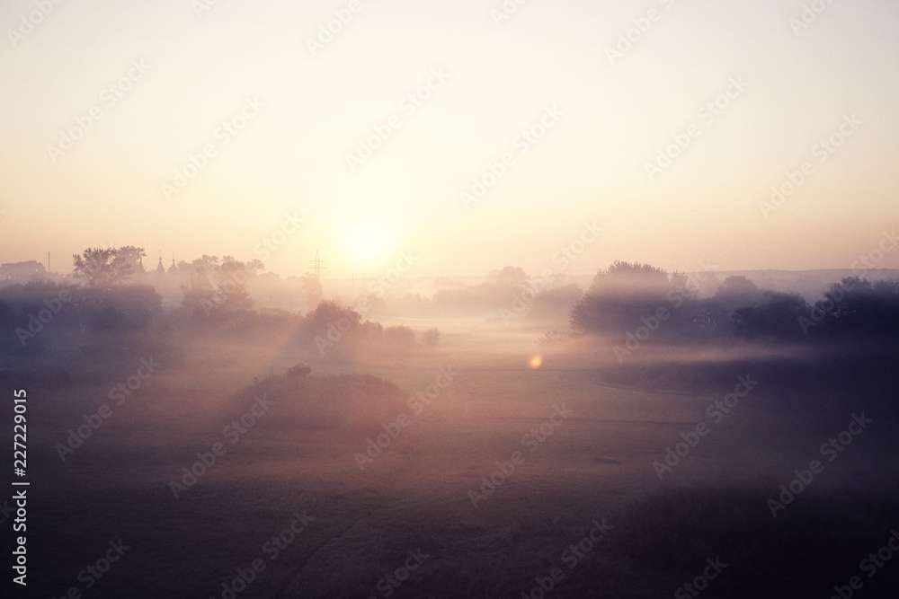 Naklejka premium Morning fog landscape